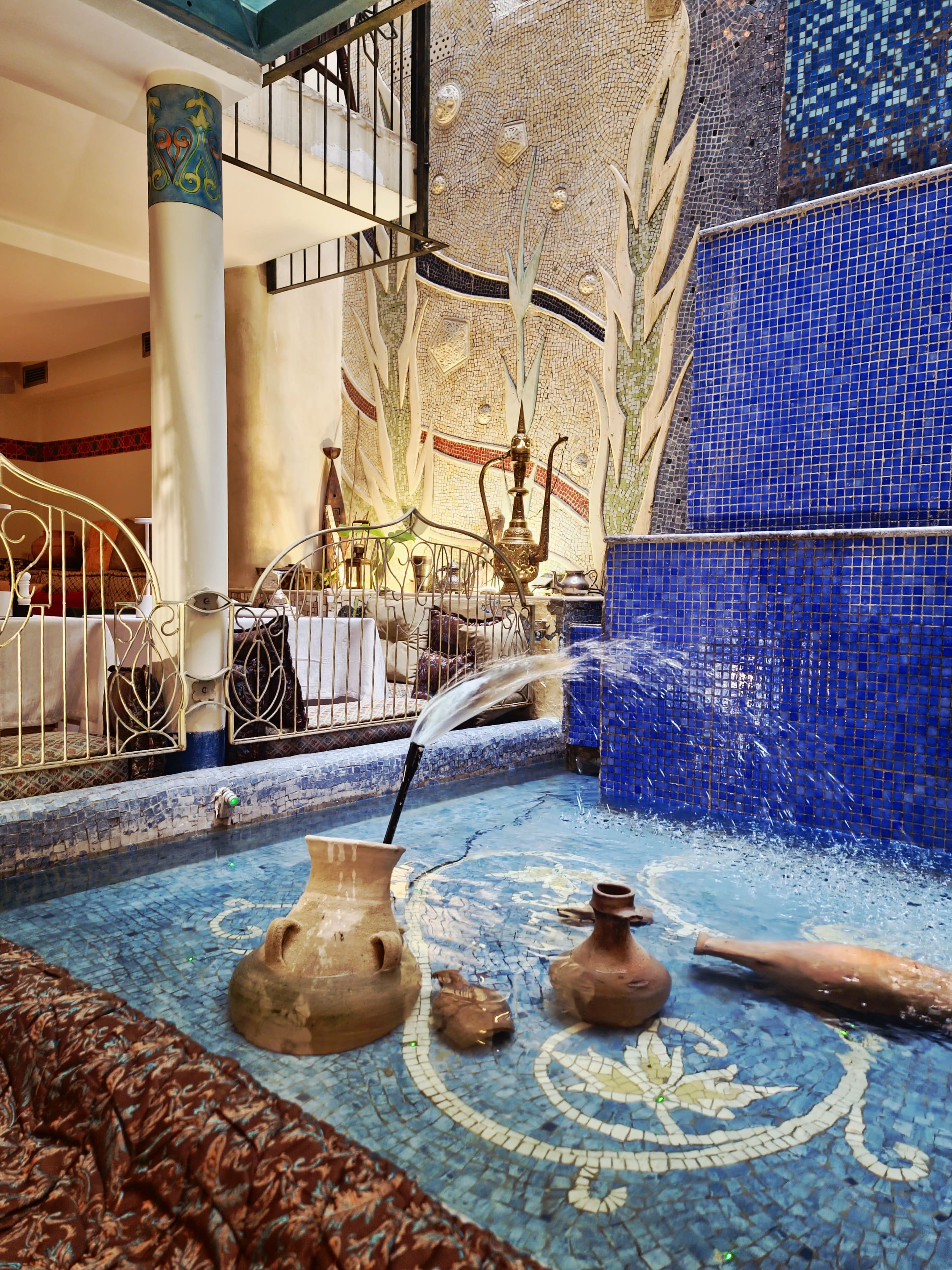 Indoor mosaic fountain with cobalt tiles